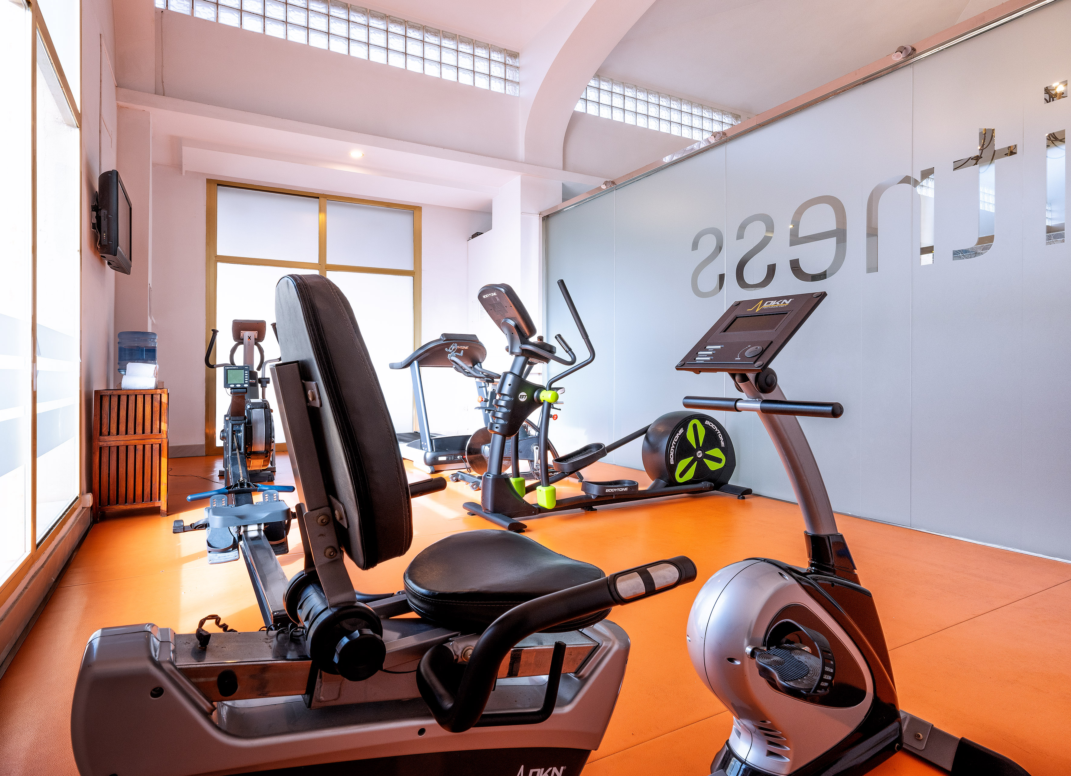 a room with exercise bikes and exercise equipment