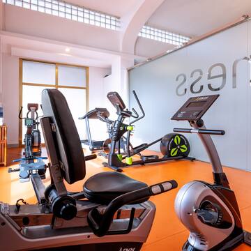 a room with exercise bikes and exercise equipment