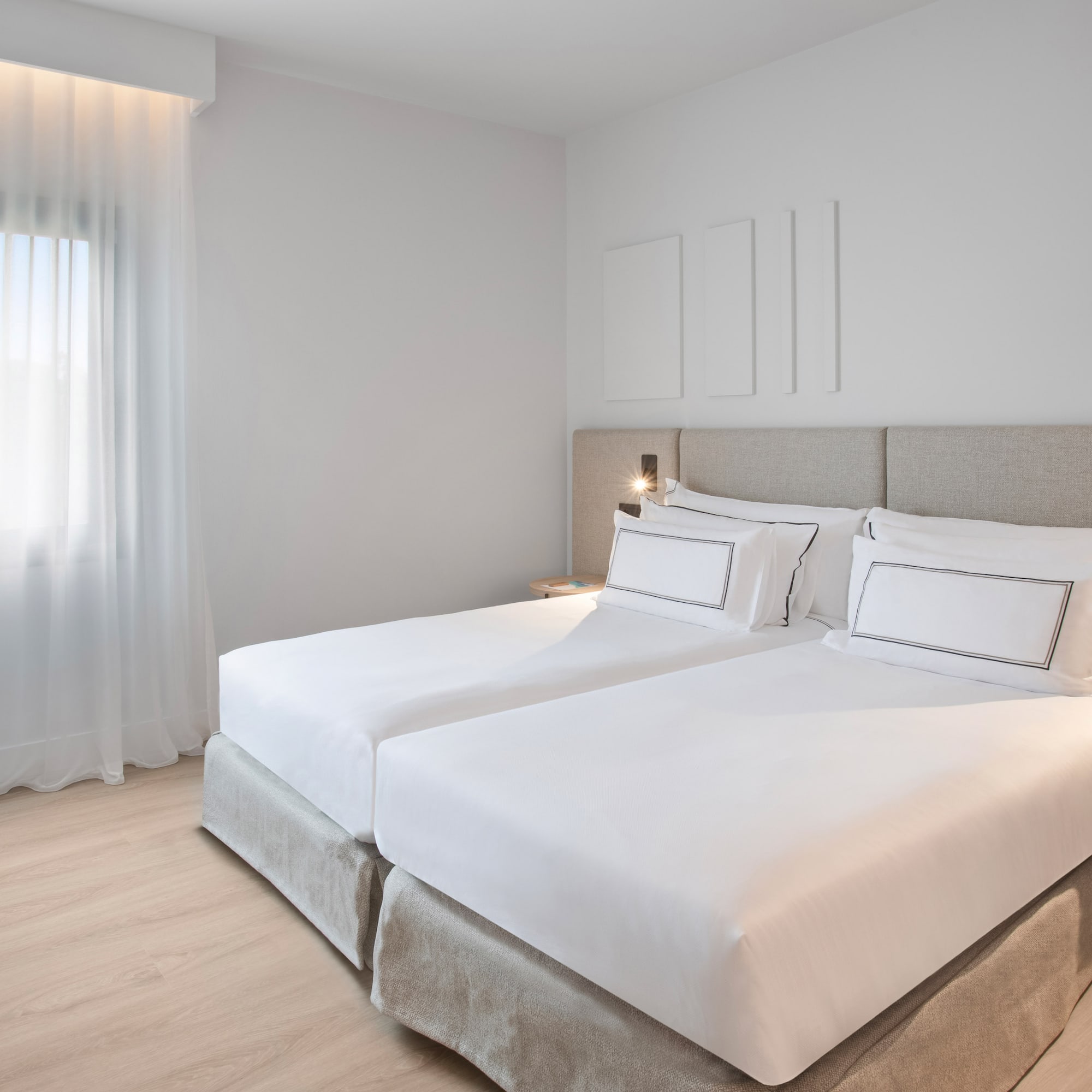 a bedroom with two beds