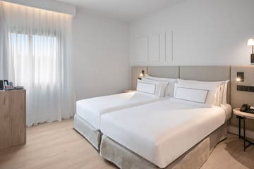 a bedroom with two beds