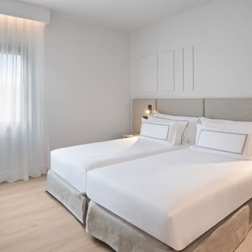 a bedroom with two beds