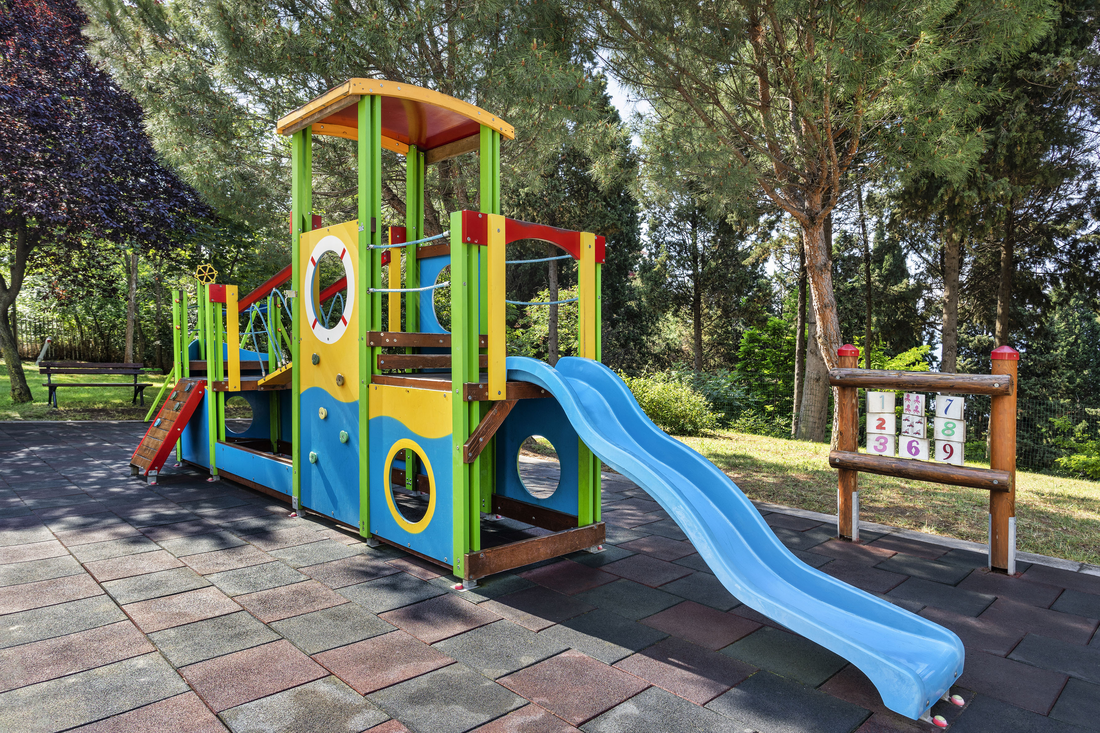 a colorful playground with a slide