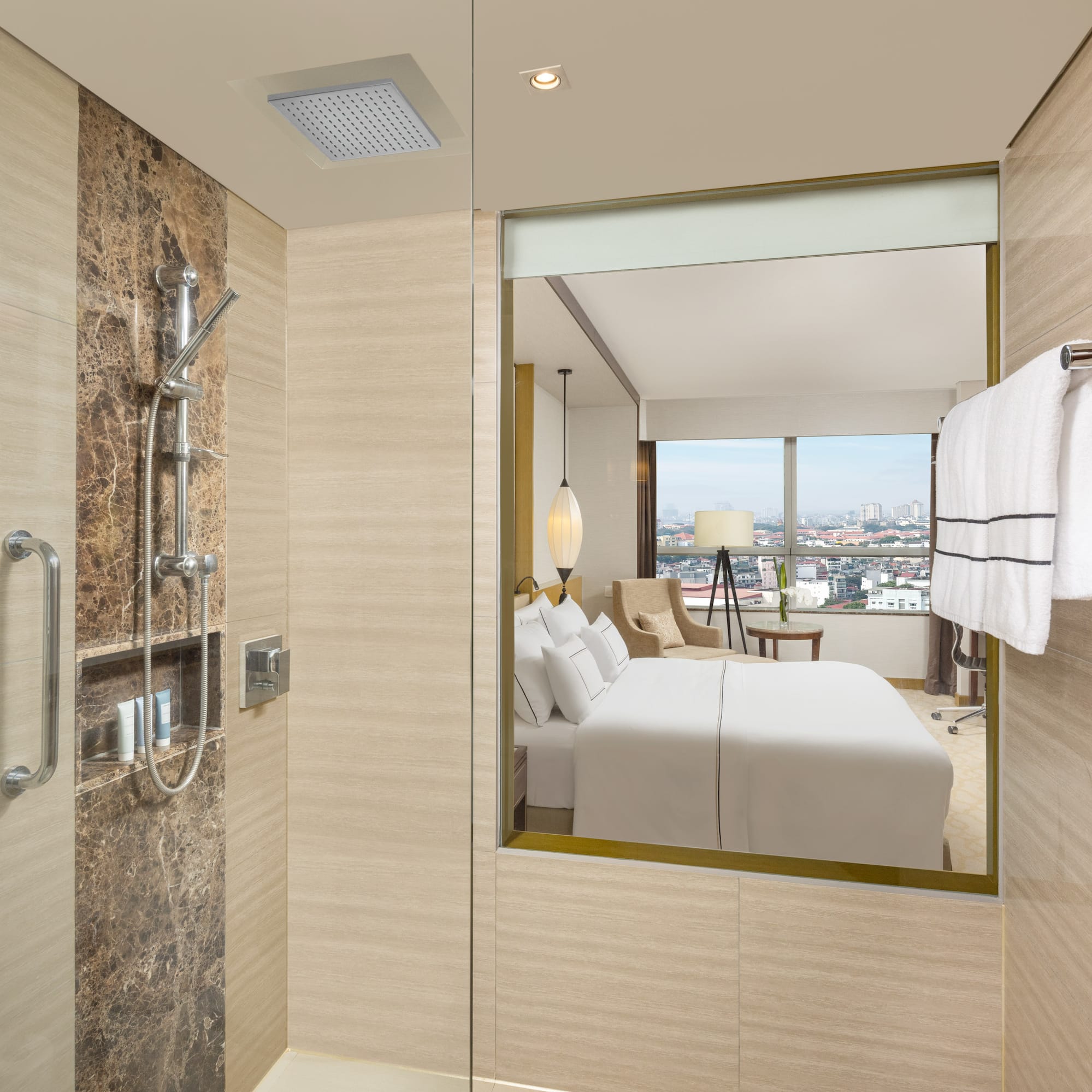 a bathroom with a mirror and a bed