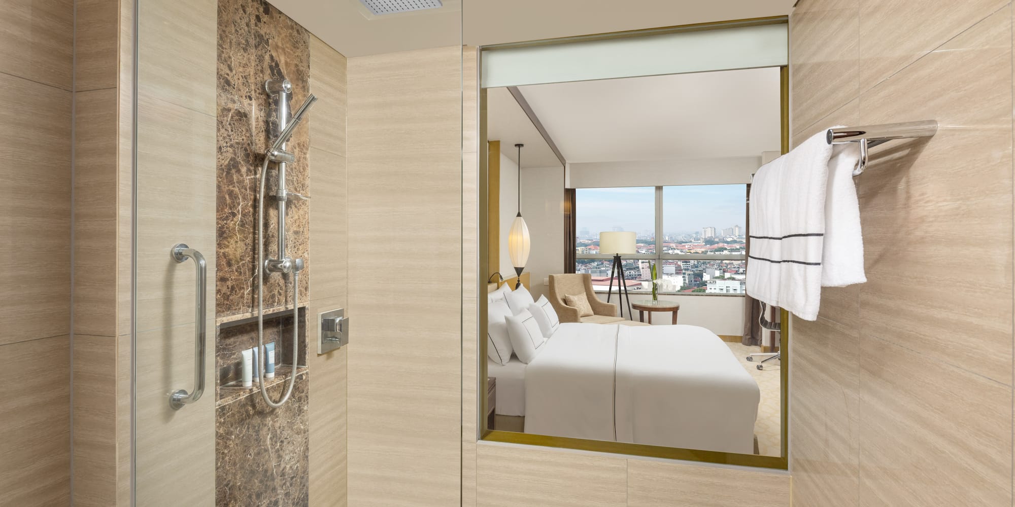 a bathroom with a mirror and a bed