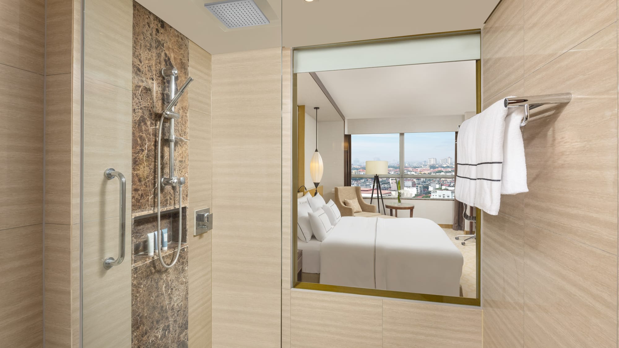 a bathroom with a mirror and a bed