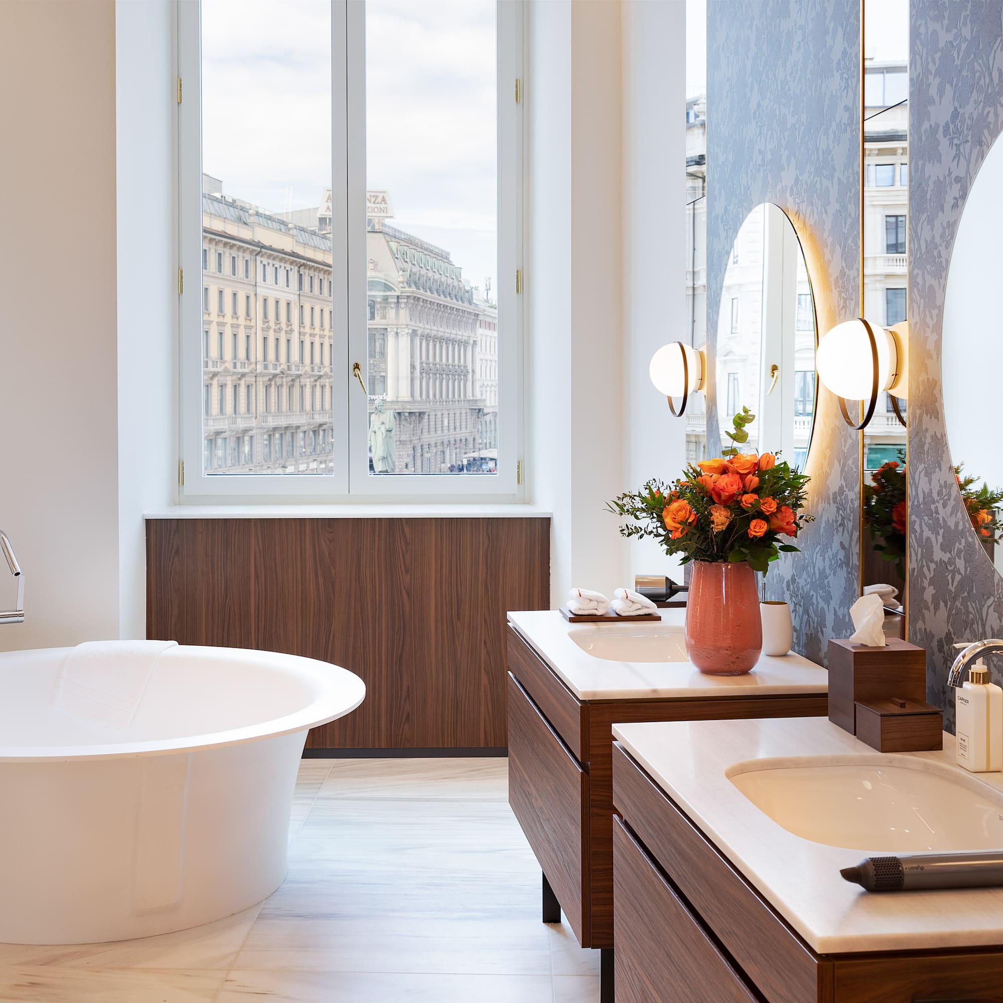 a bathroom with a tub and mirrors