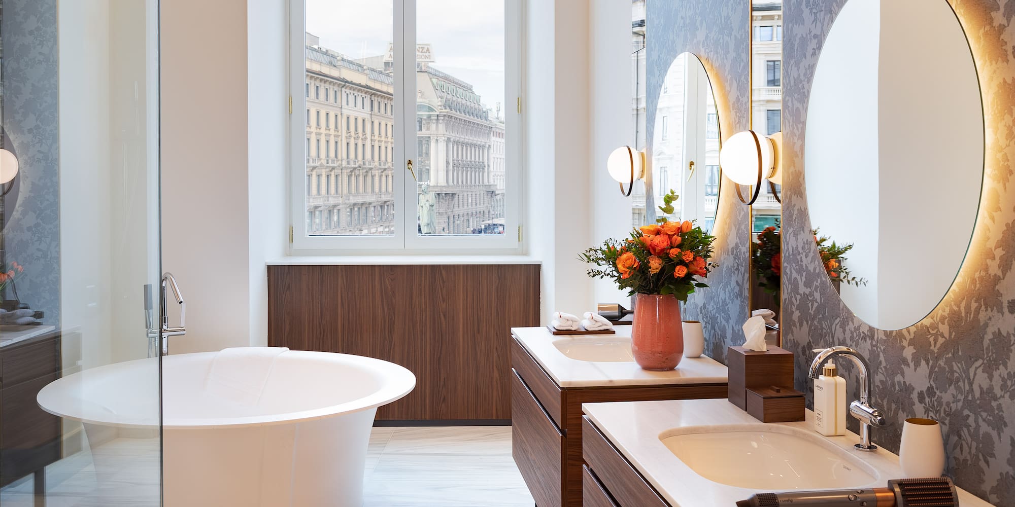 a bathroom with a tub and mirrors