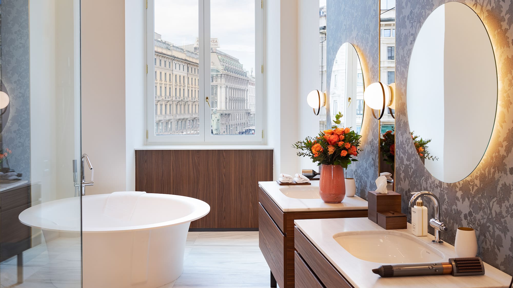 a bathroom with a tub and mirrors