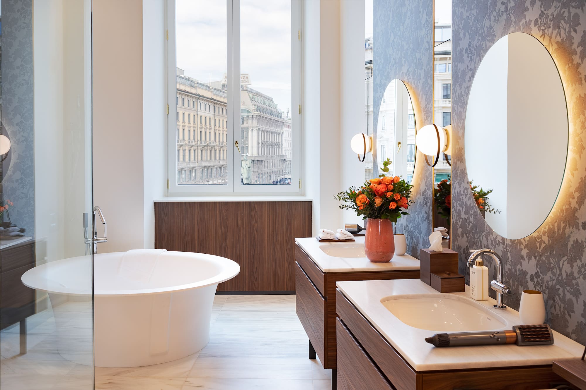 a bathroom with a tub and mirrors