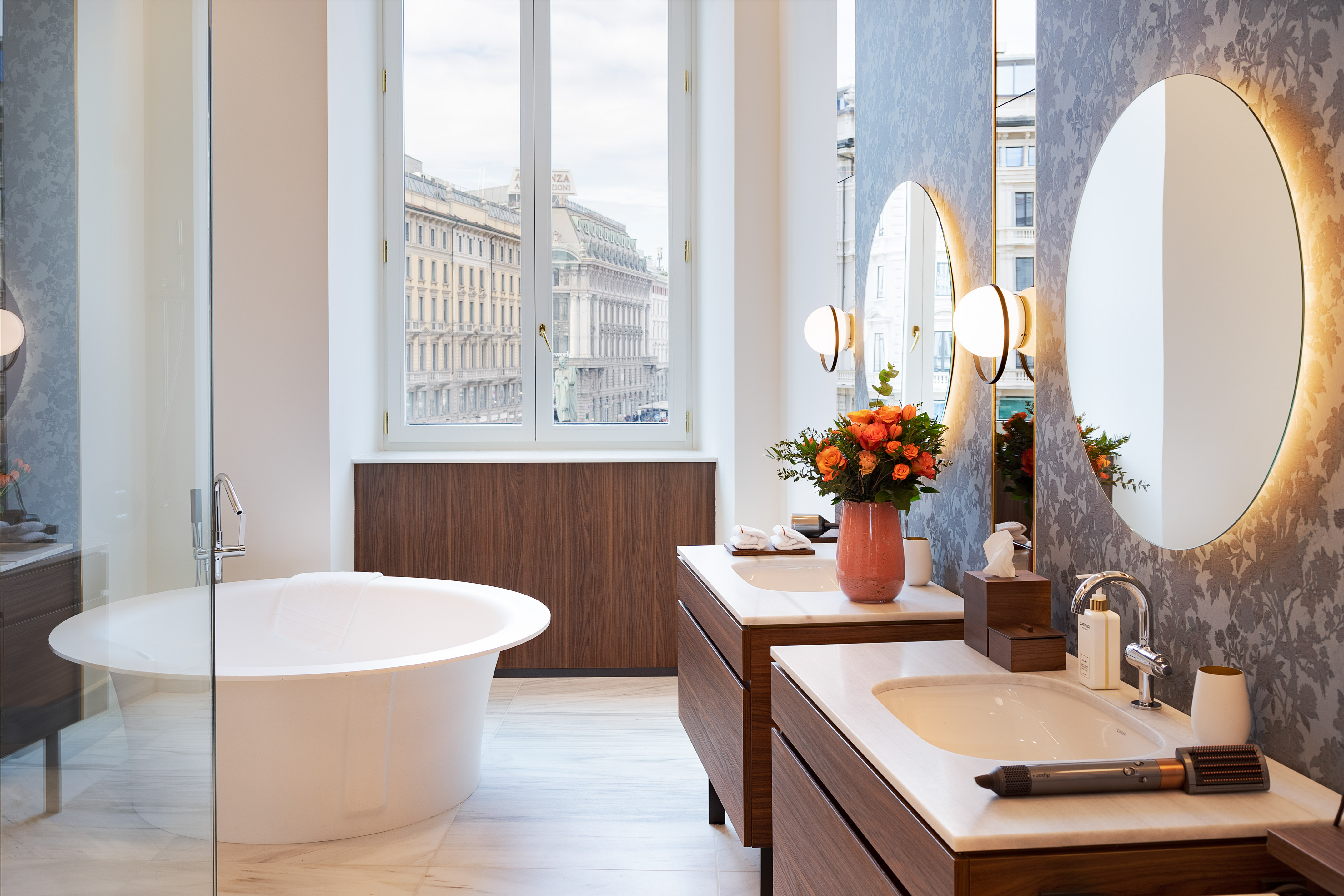 a bathroom with a tub and mirrors
