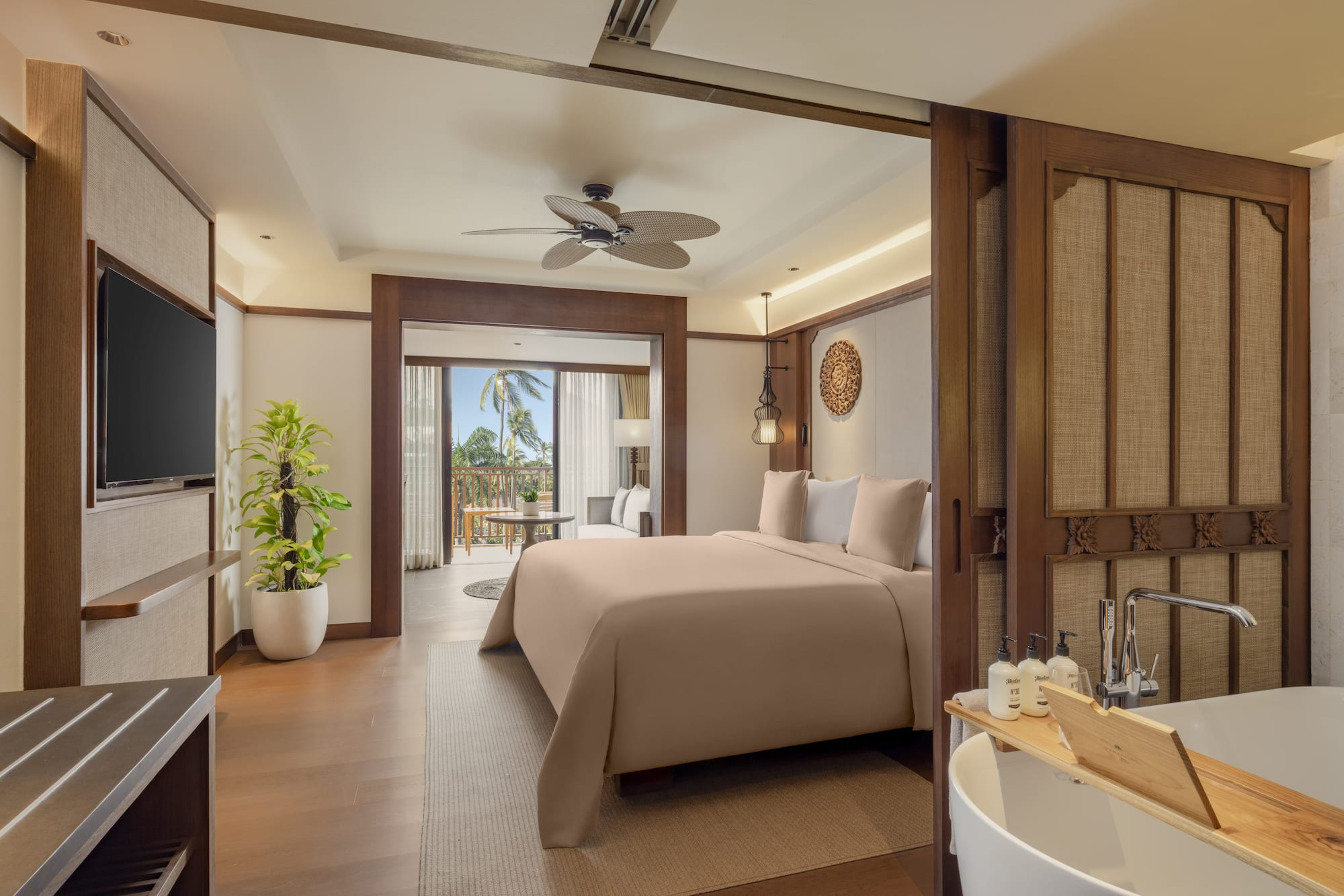 a bedroom with a television and a bed