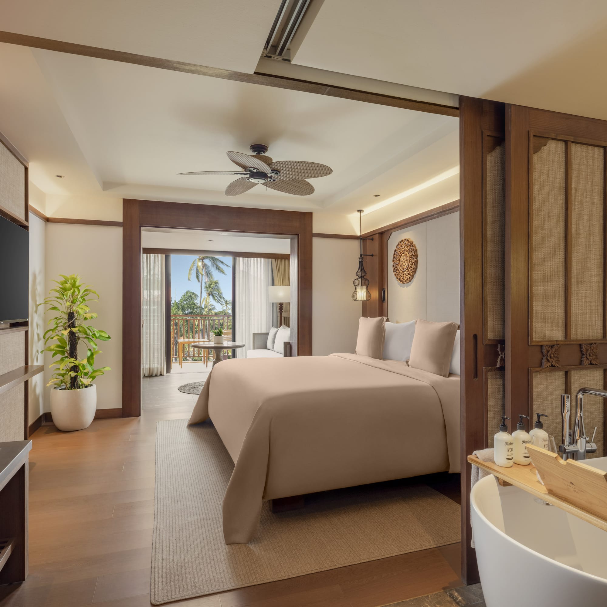 a bedroom with a television and a bed