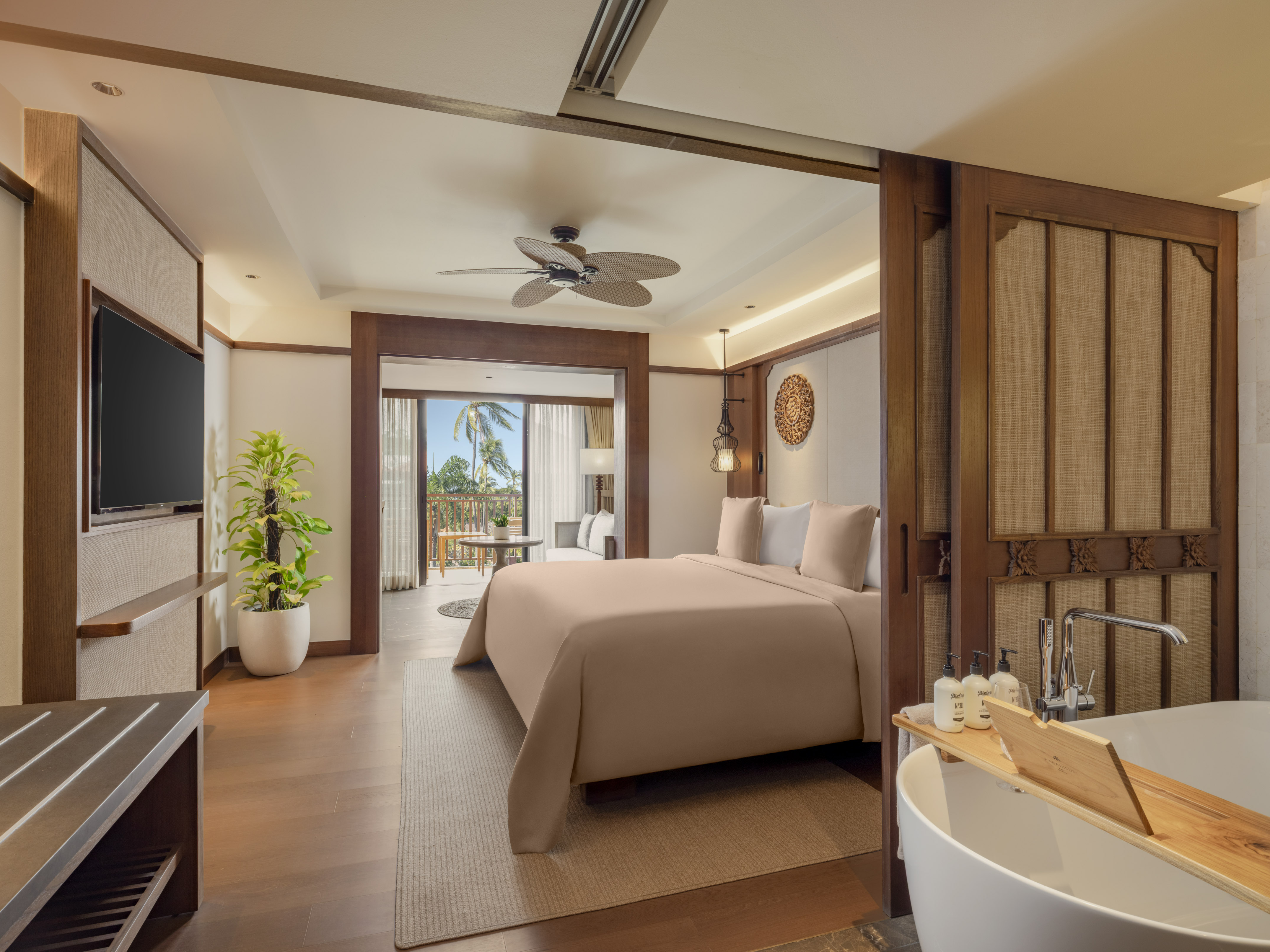 a bedroom with a television and a bed