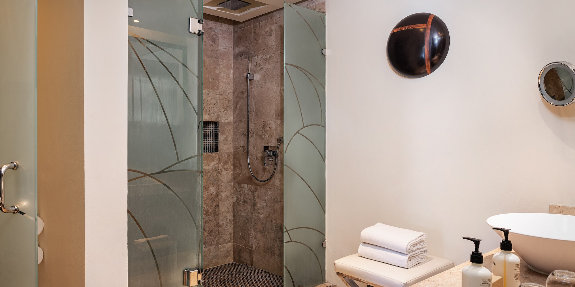 a bathroom with a shower and a sink