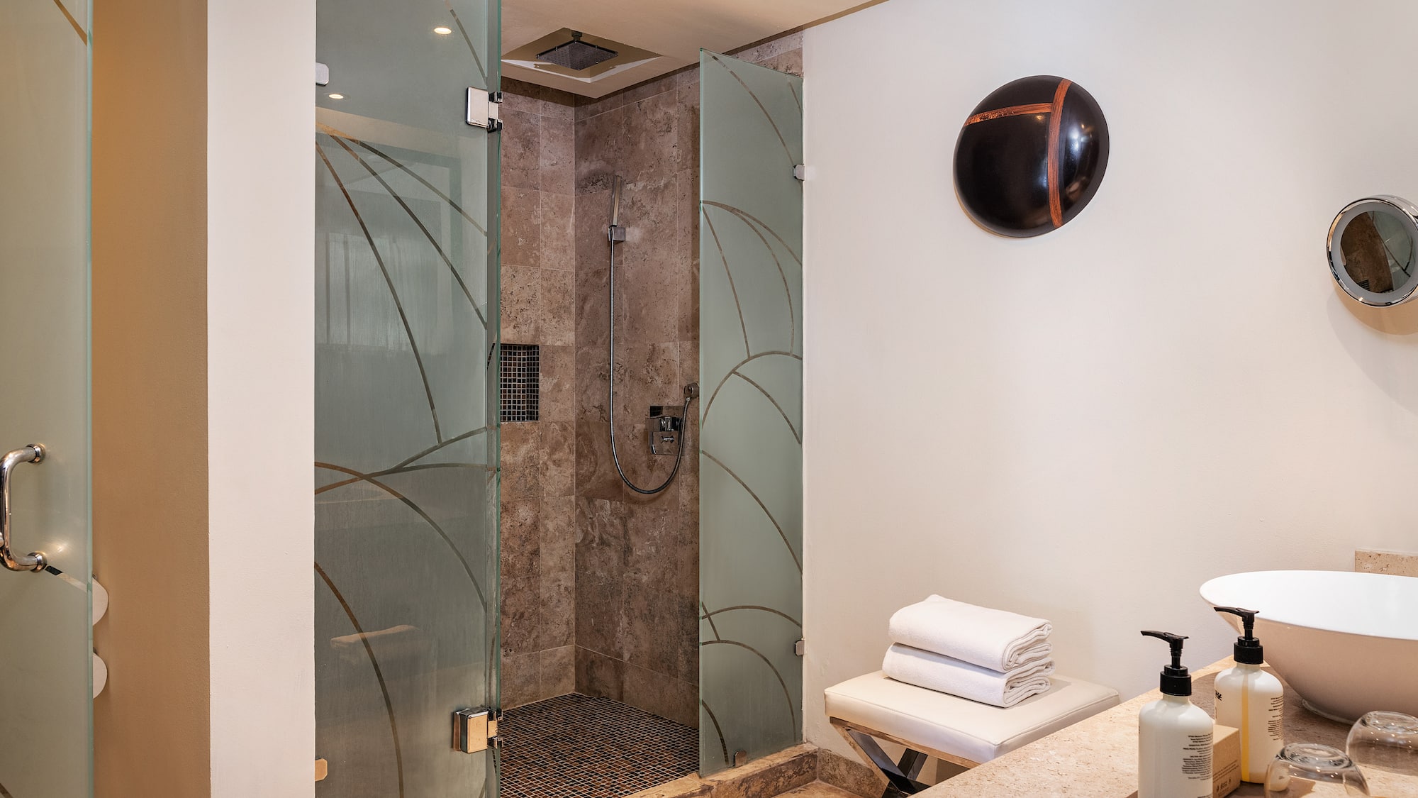 a bathroom with a shower and a sink