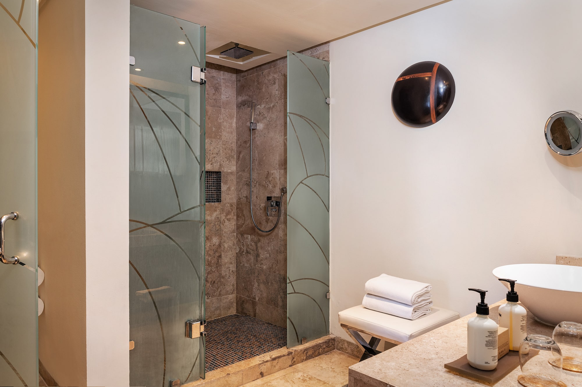 a bathroom with a shower and a sink