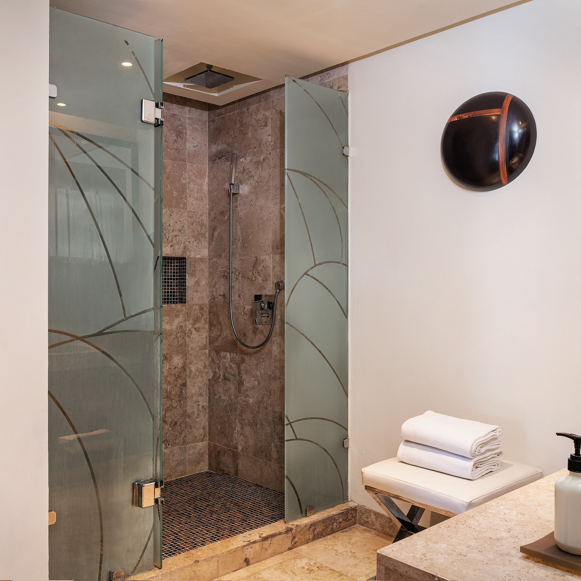 a bathroom with a shower and a sink