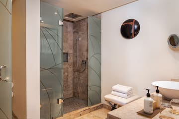 a bathroom with a shower and a sink
