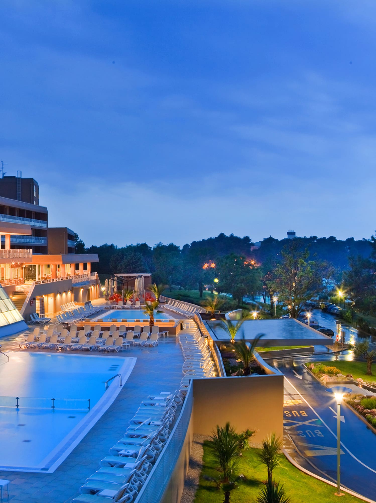 a pool and a building with a glass roof