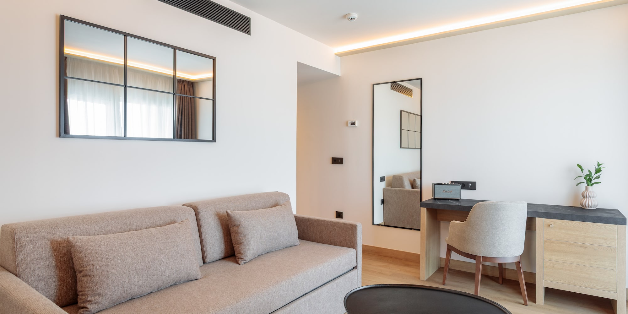 a living room with a couch and a table