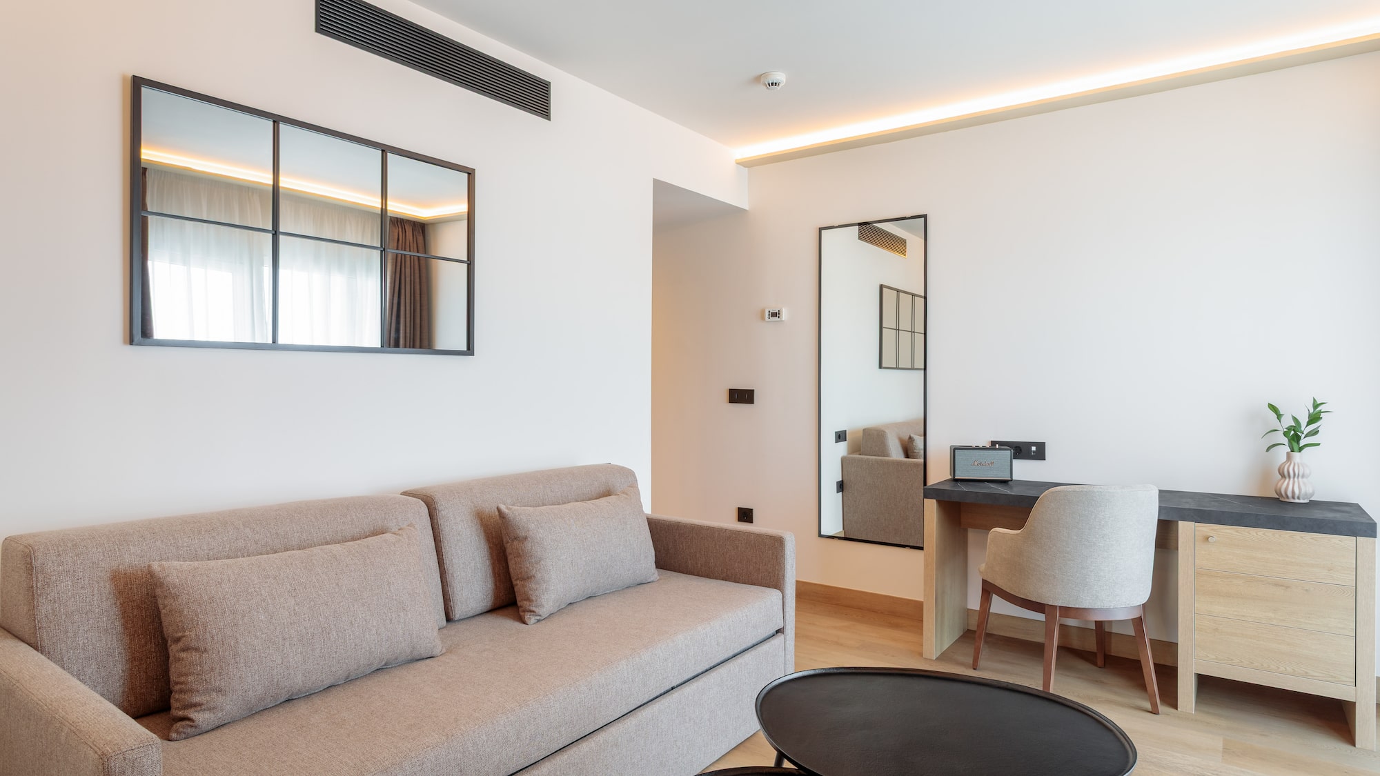 a living room with a couch and a table