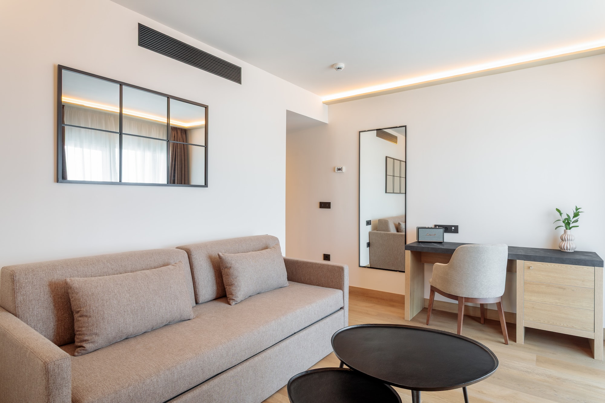 a living room with a couch and a table