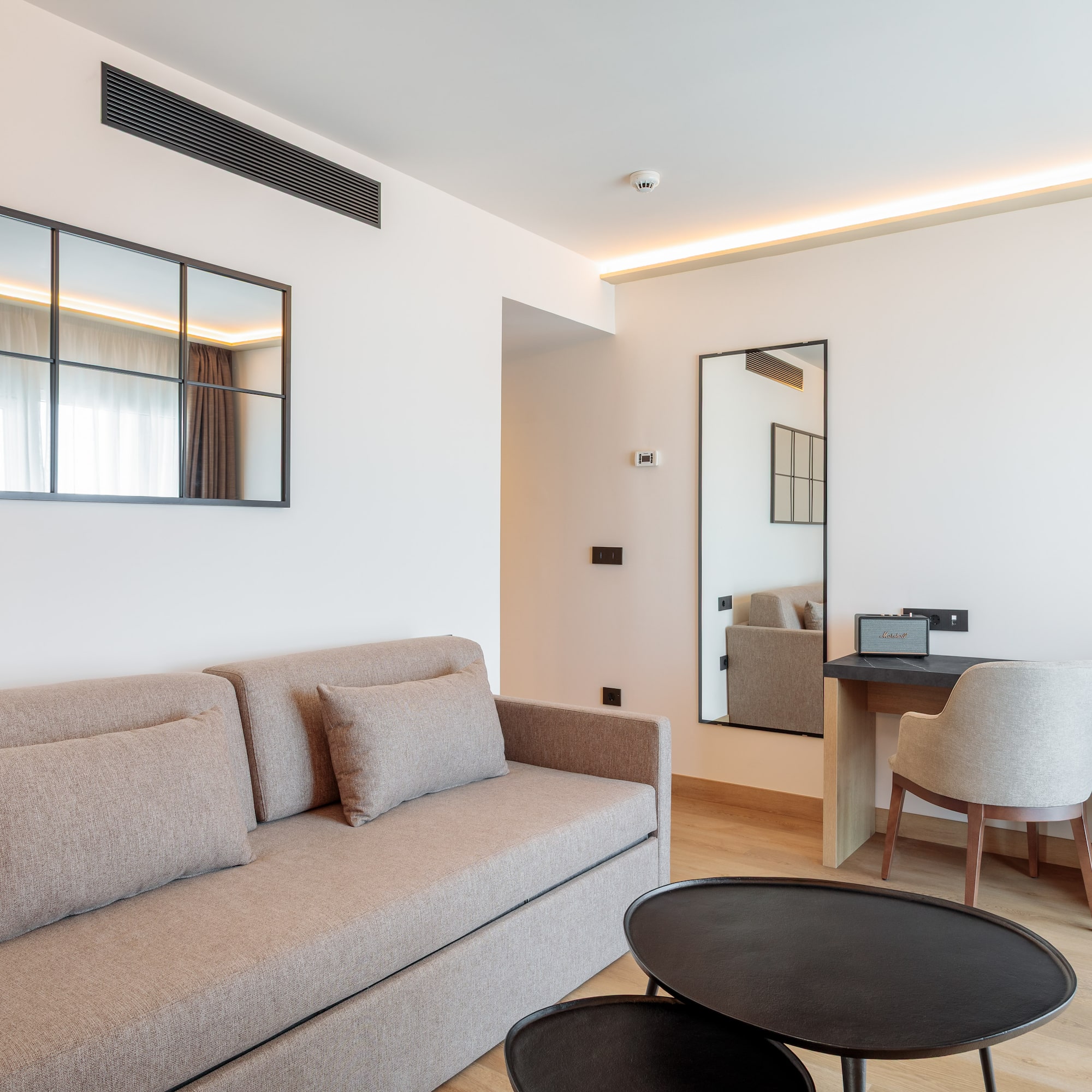 a living room with a couch and a table