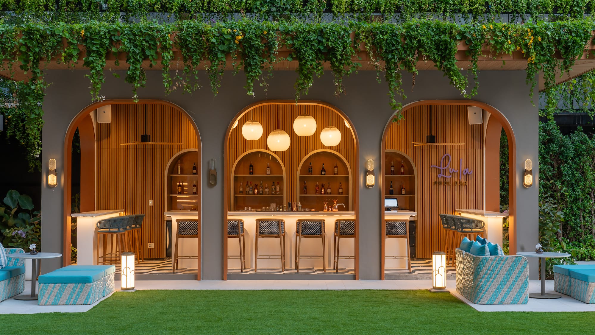a bar with chairs and a bar stools