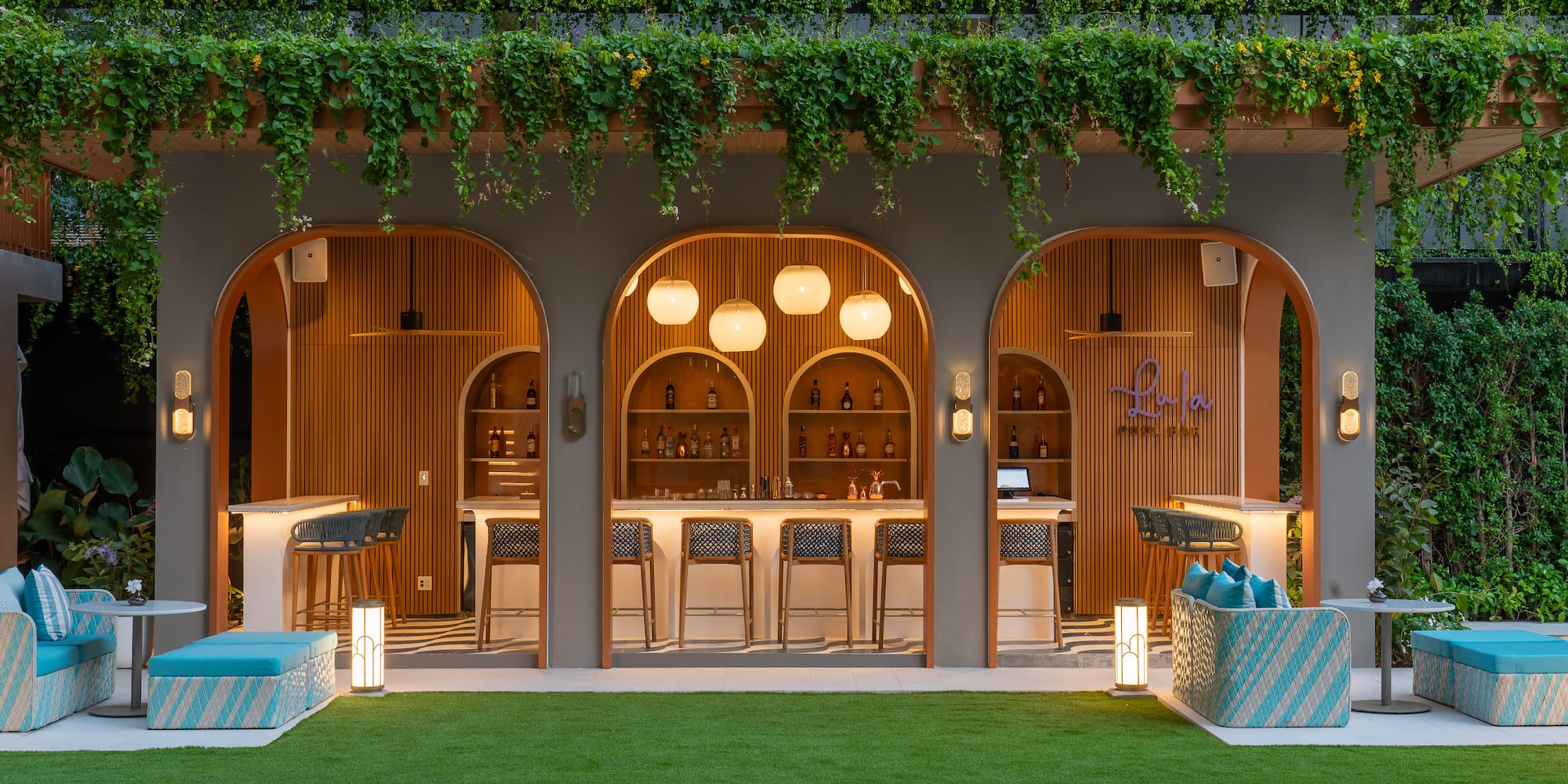 a bar with chairs and a bar stools