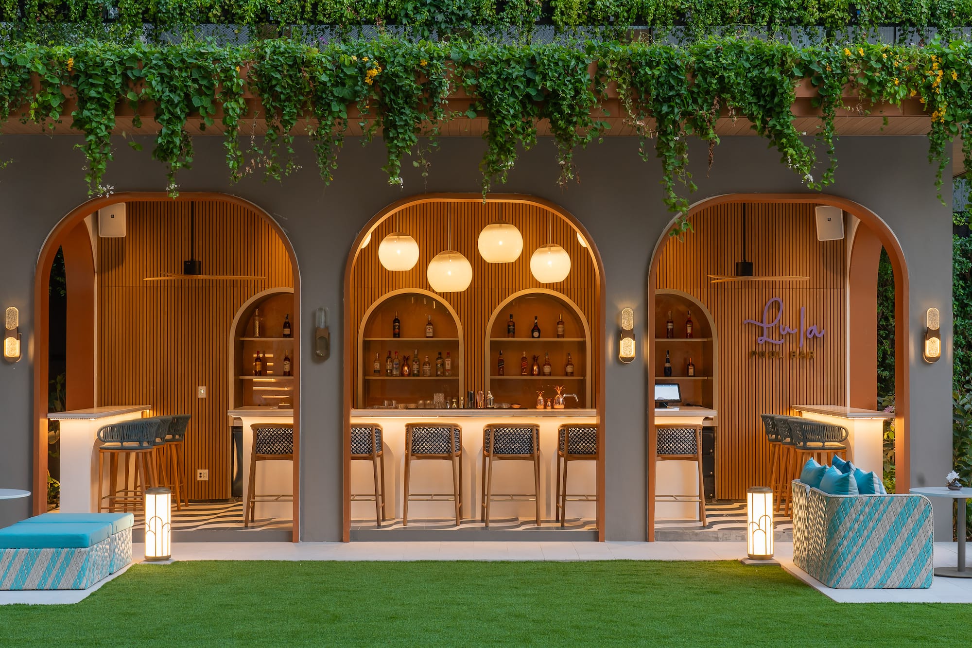 a bar with chairs and a bar stools