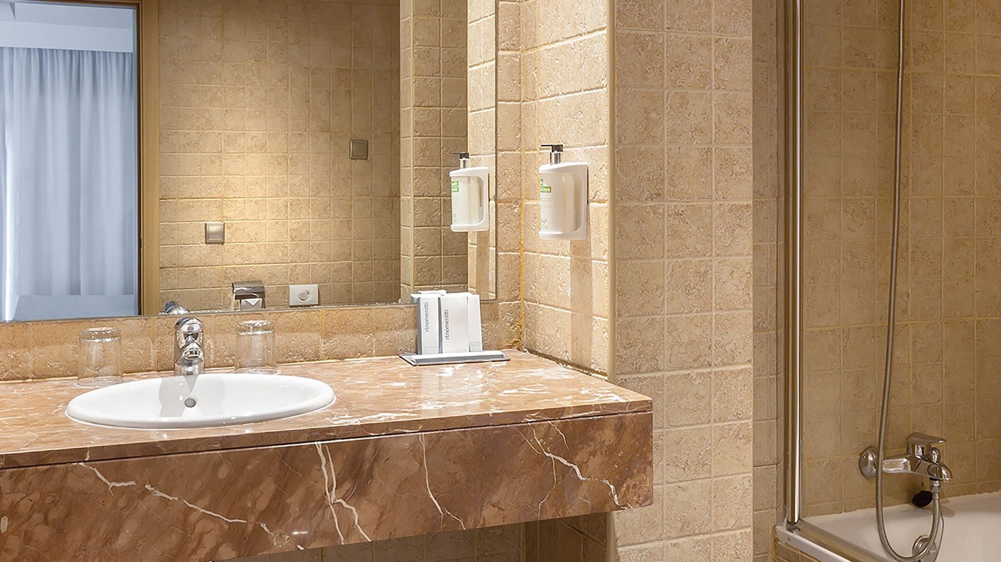 a bathroom with a sink and shower