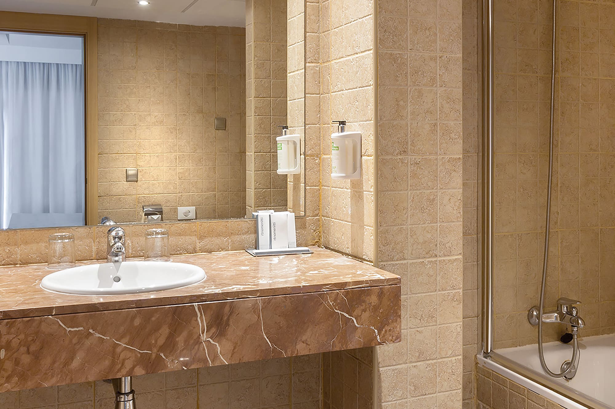 a bathroom with a sink and shower