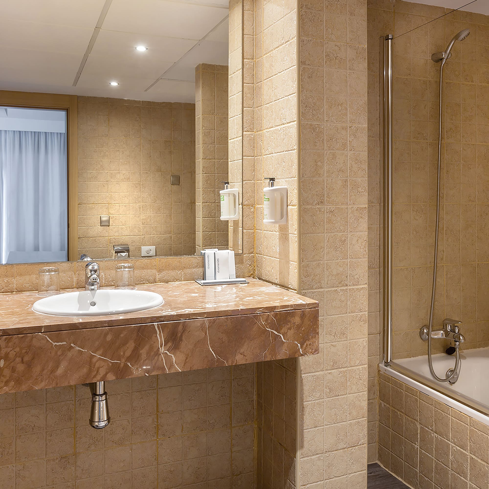 a bathroom with a sink and shower