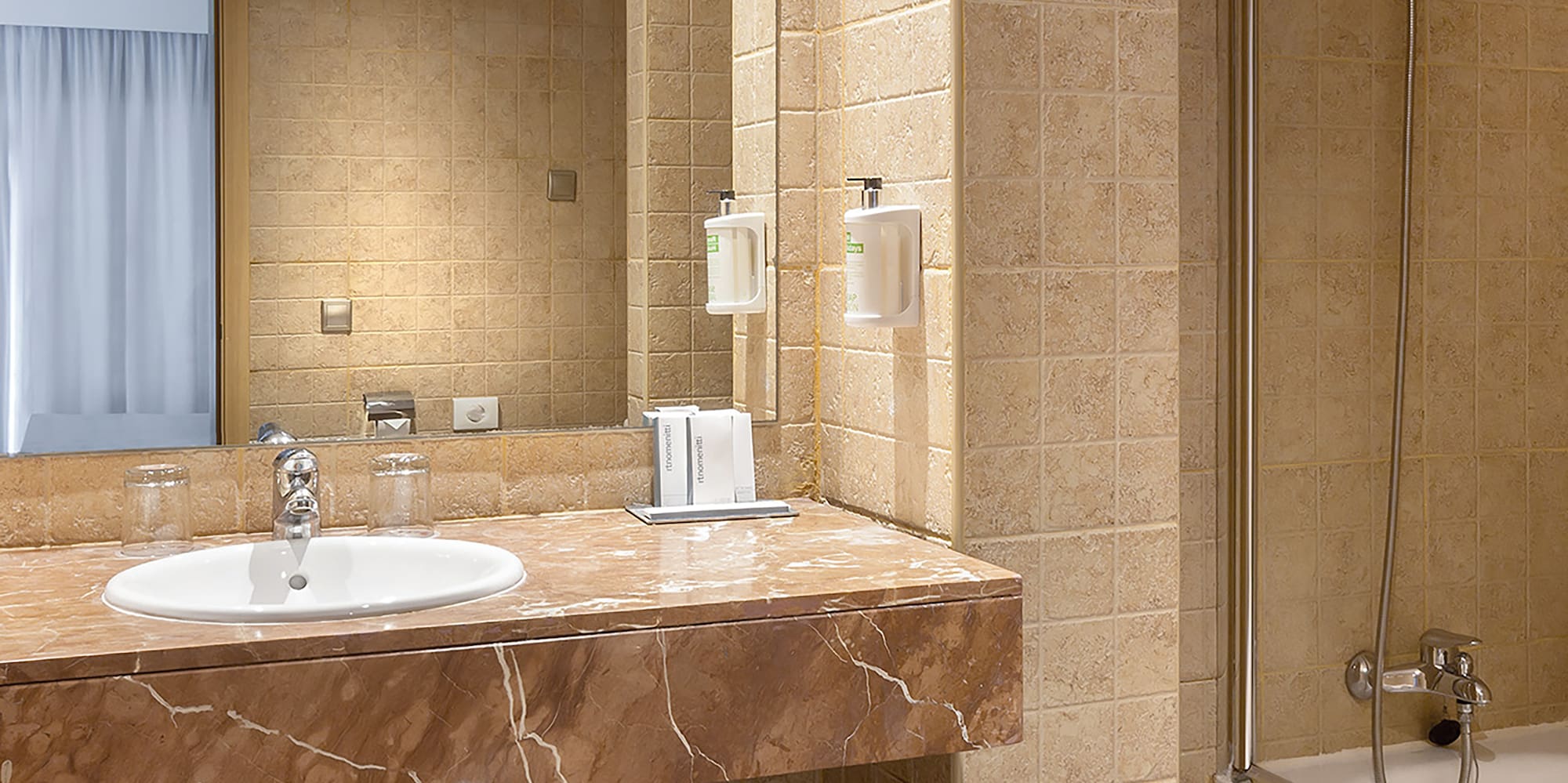 a bathroom with a sink and shower