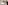 a bedroom with a large bed and a chair