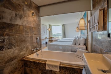 a bathroom with a bathtub and a sink