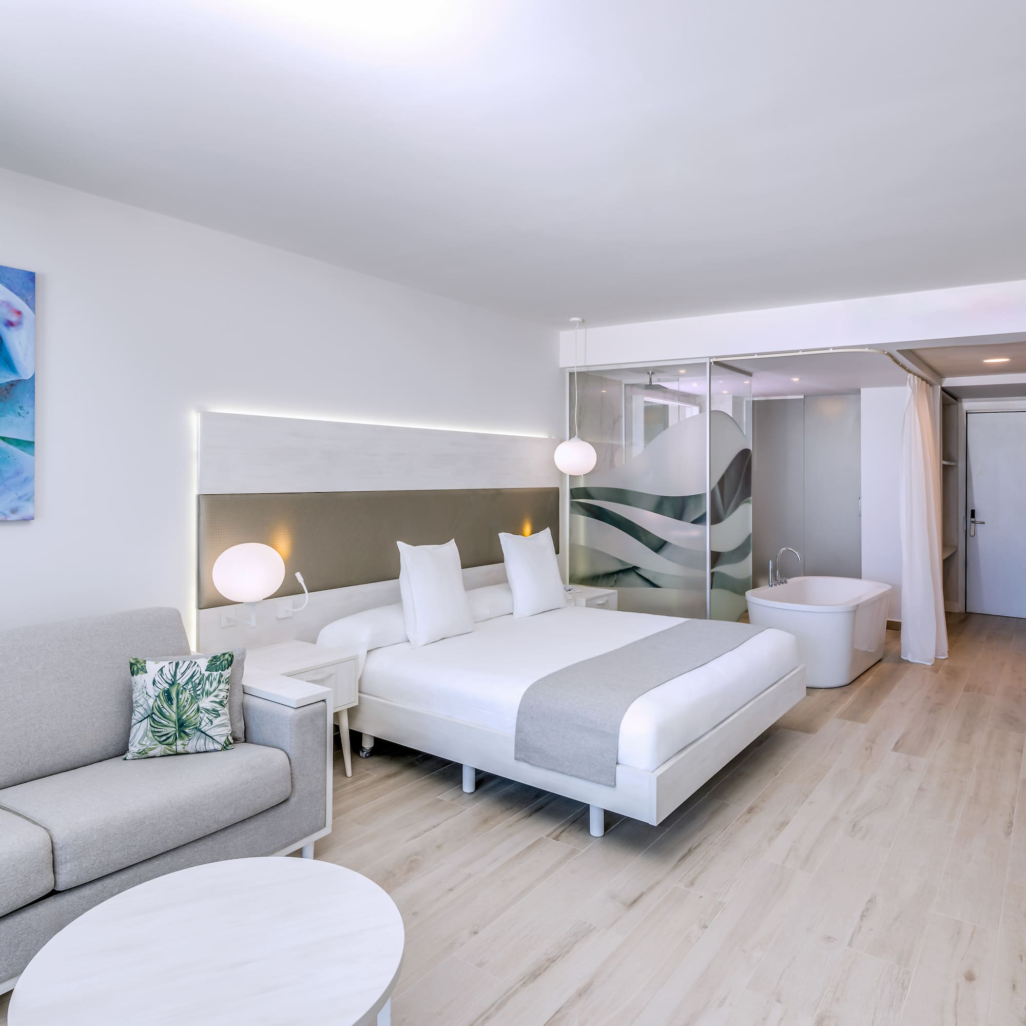 a room with a bed and a tub