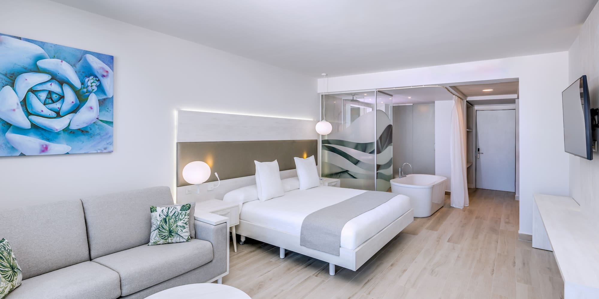 a room with a bed and a tub