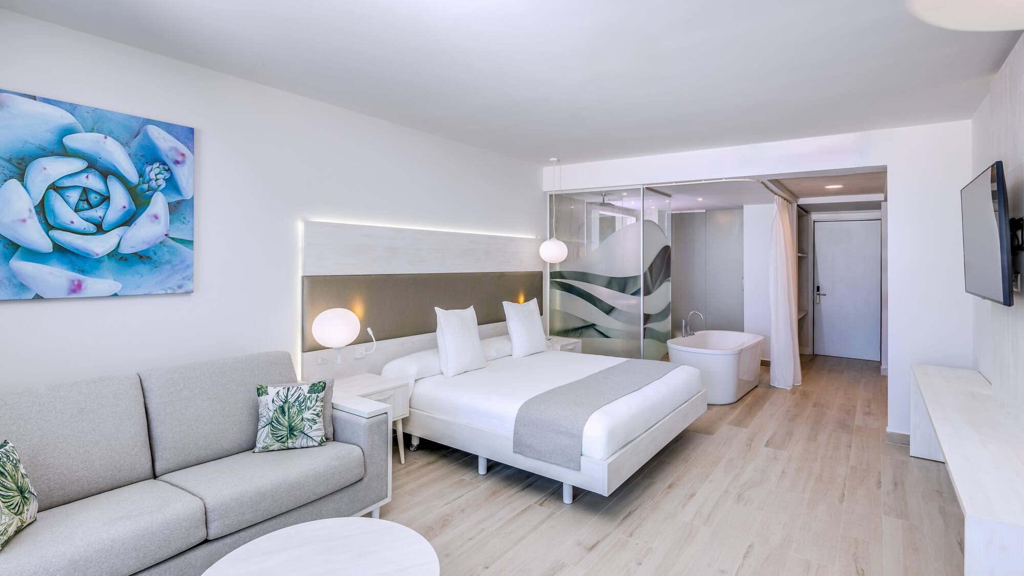 a room with a bed and a tub