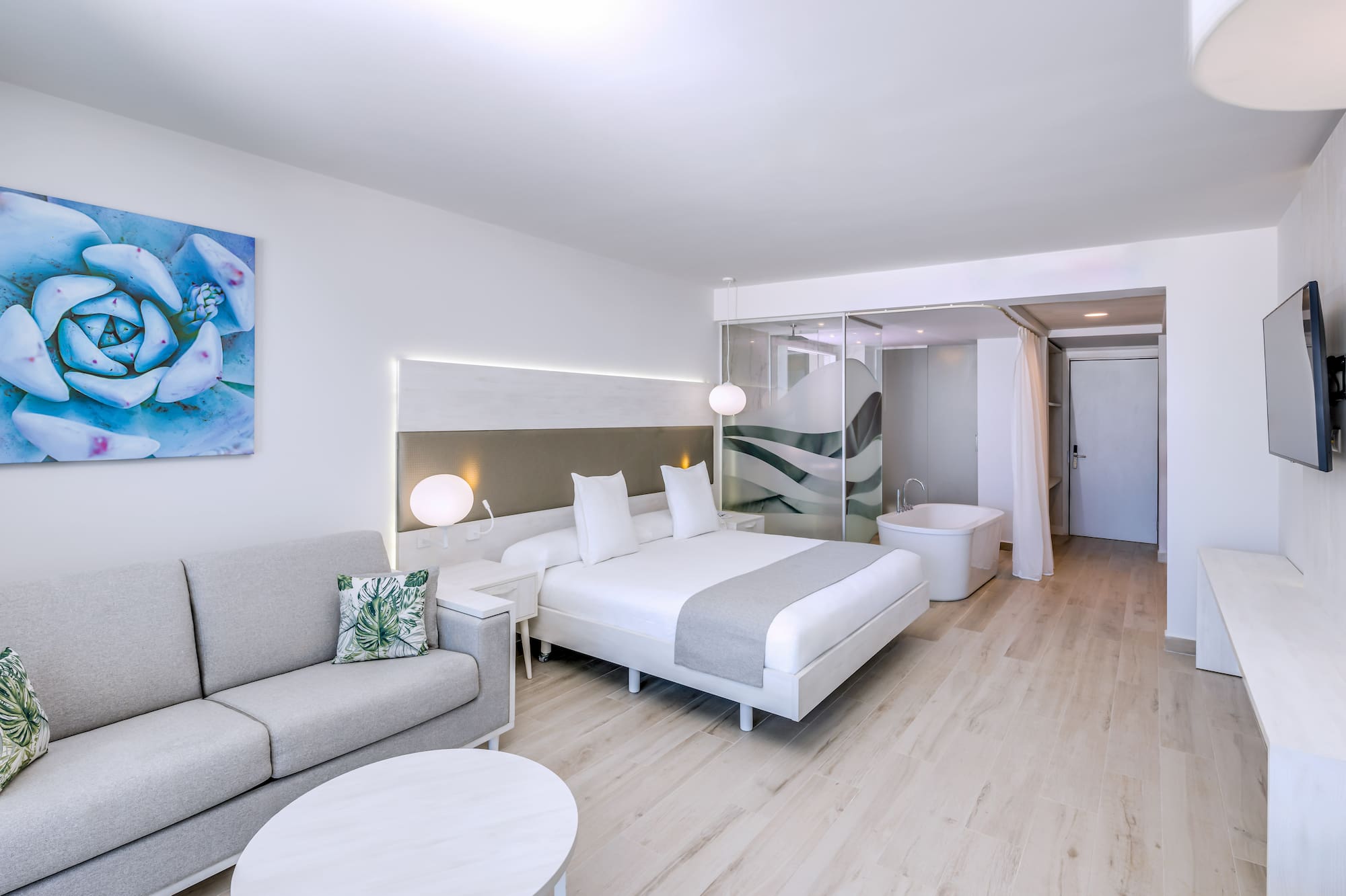 a room with a bed and a tub