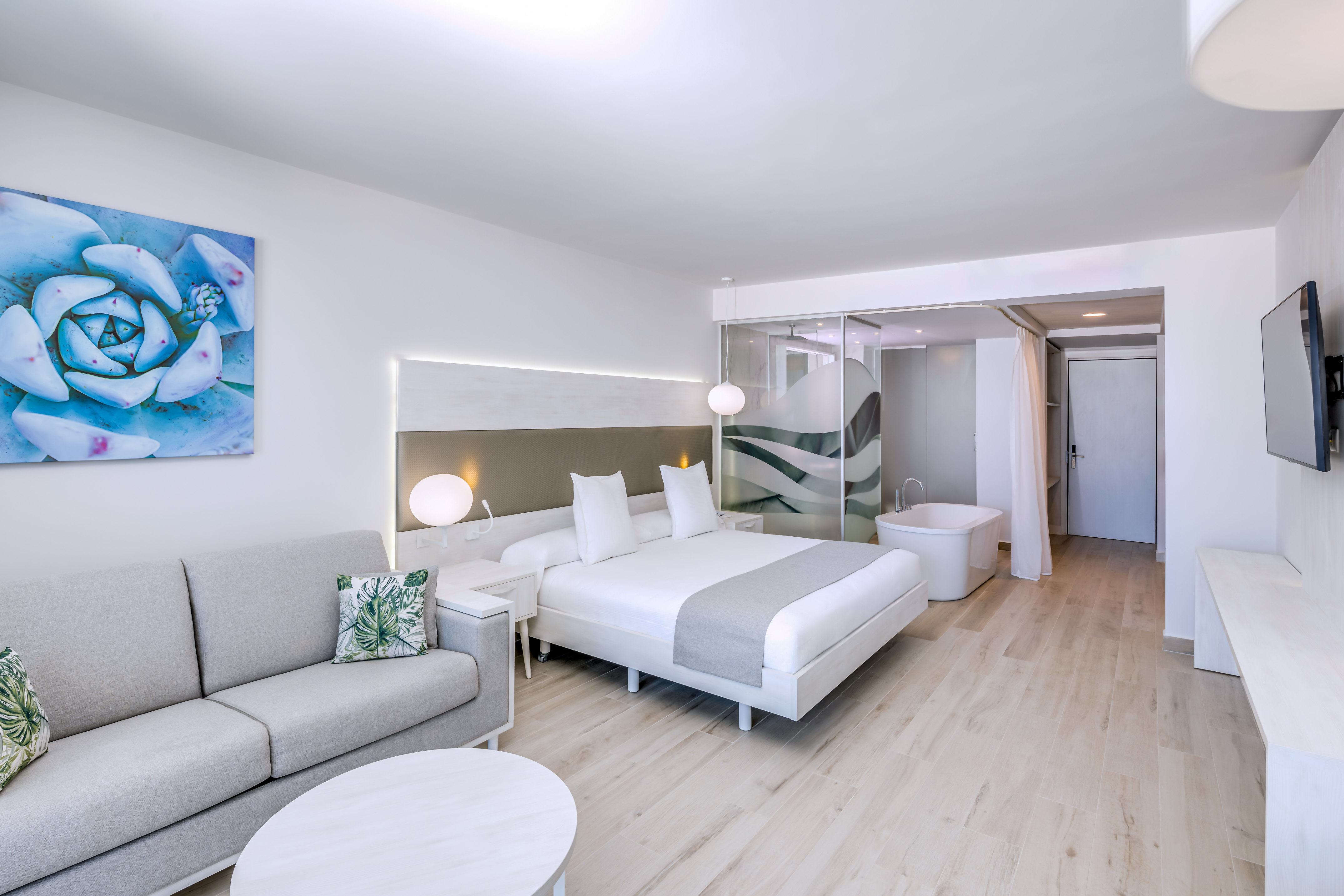 a room with a bed and a tub