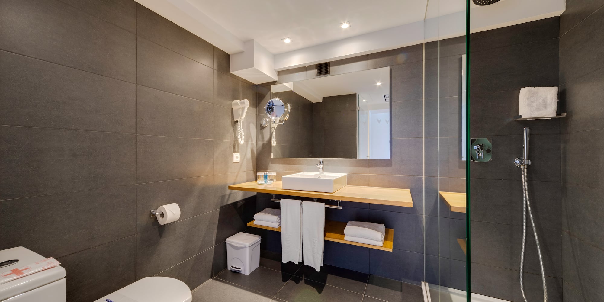 a bathroom with a shower and sink