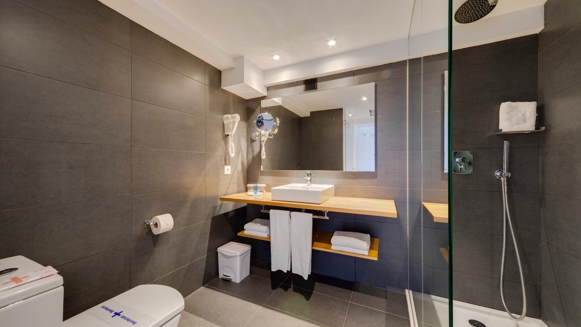 a bathroom with a shower and sink