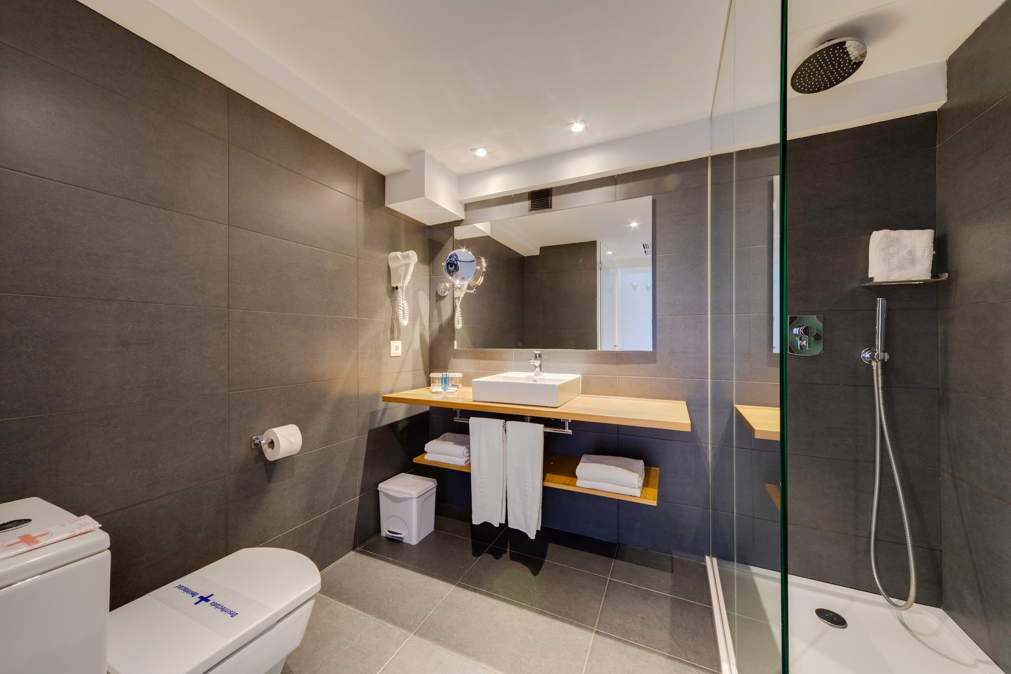 a bathroom with a shower and sink