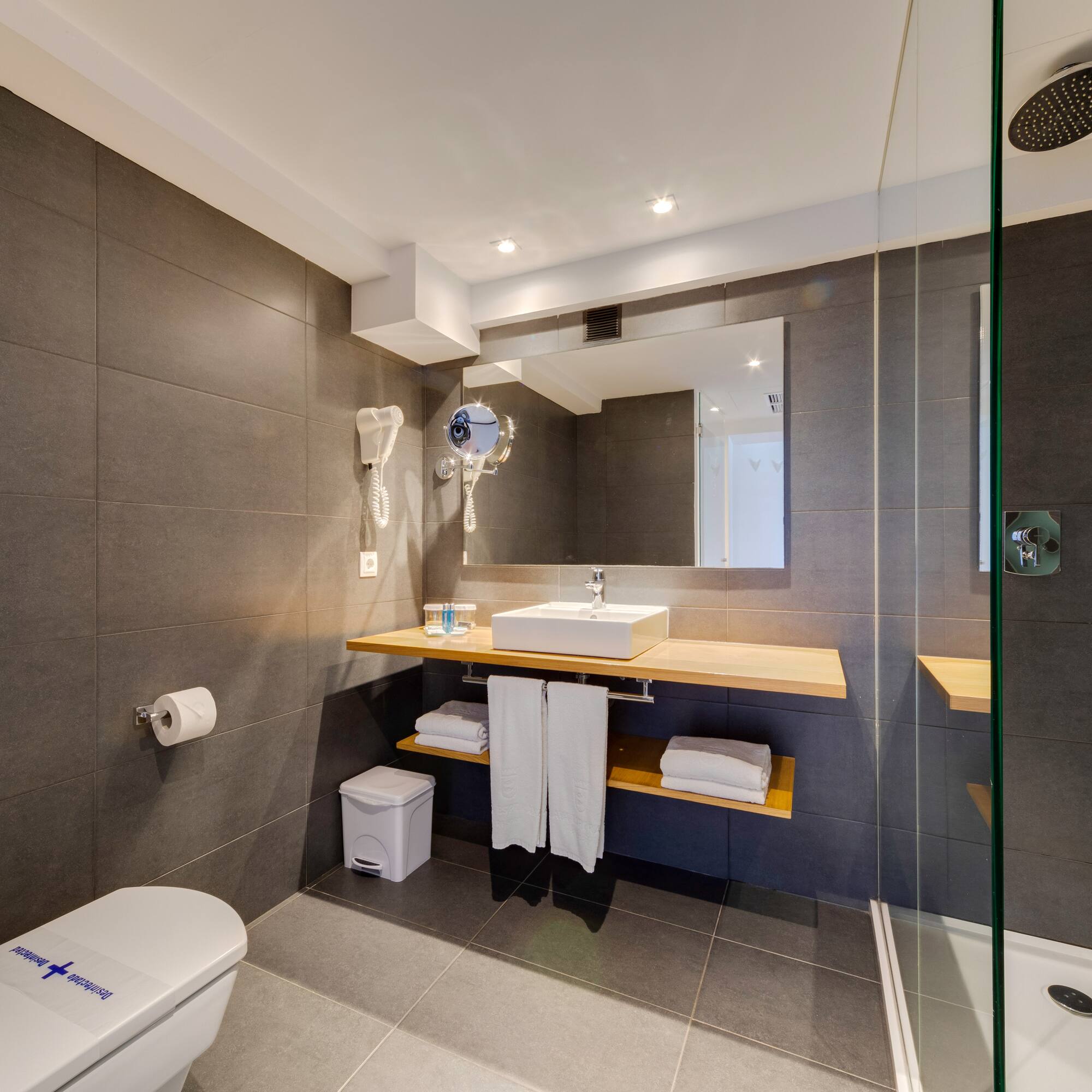 a bathroom with a shower and sink