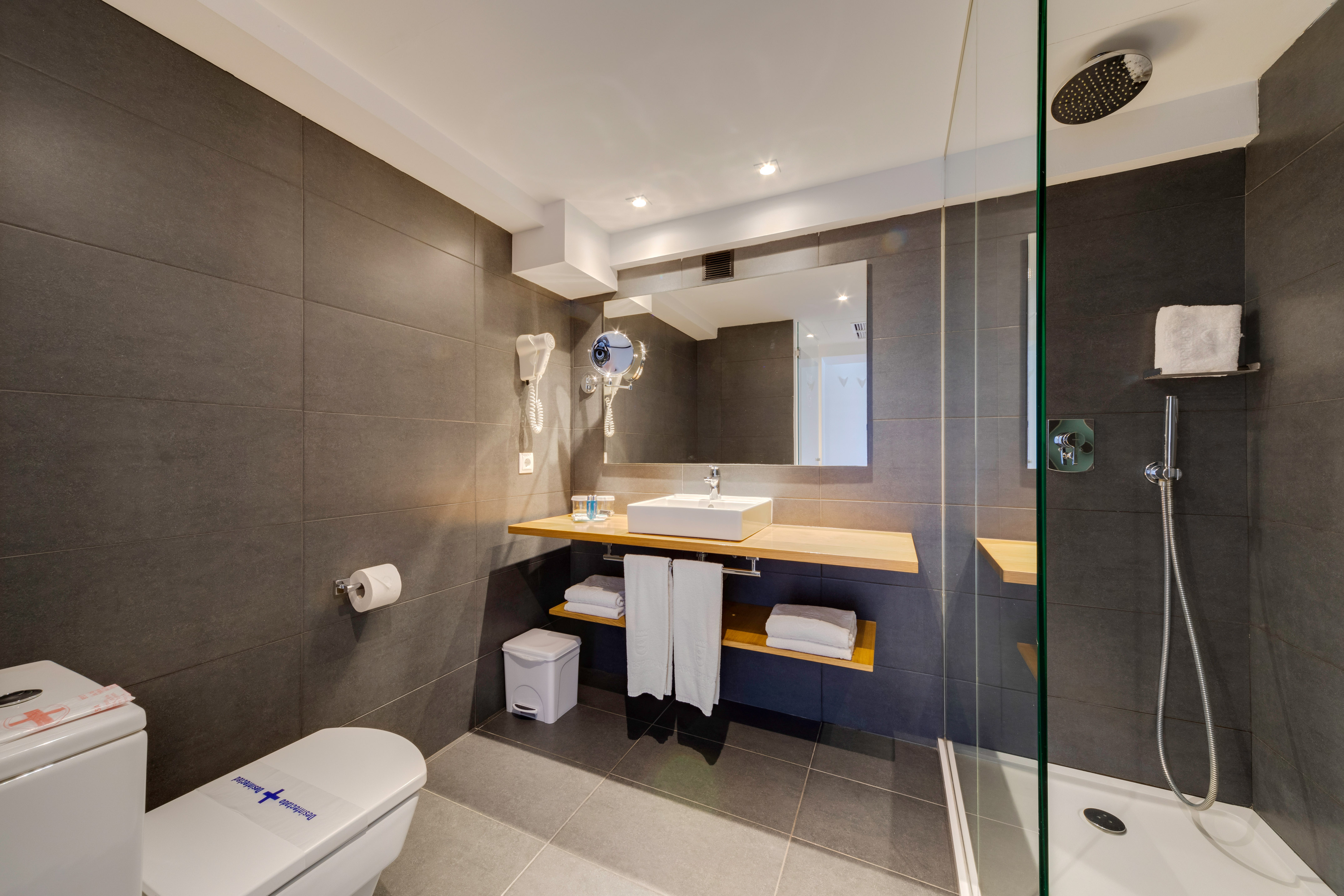 a bathroom with a shower and sink