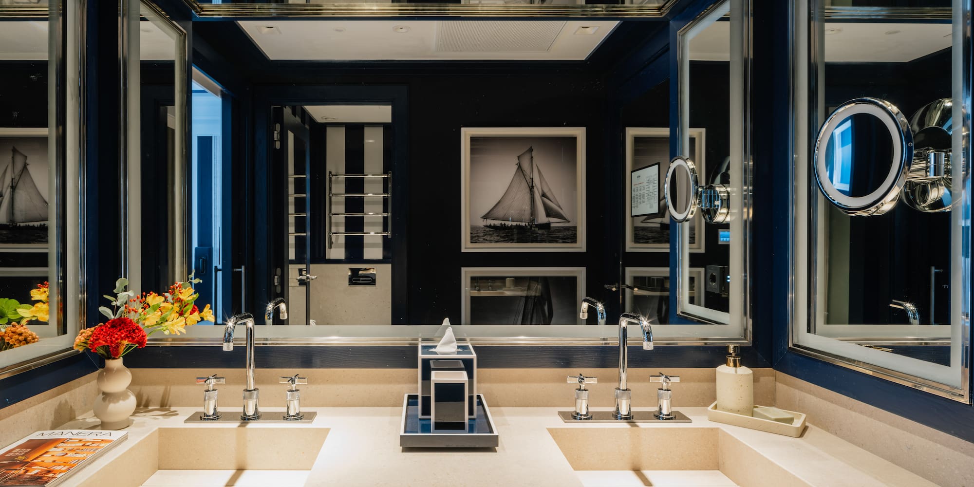 a bathroom with sinks and mirrors