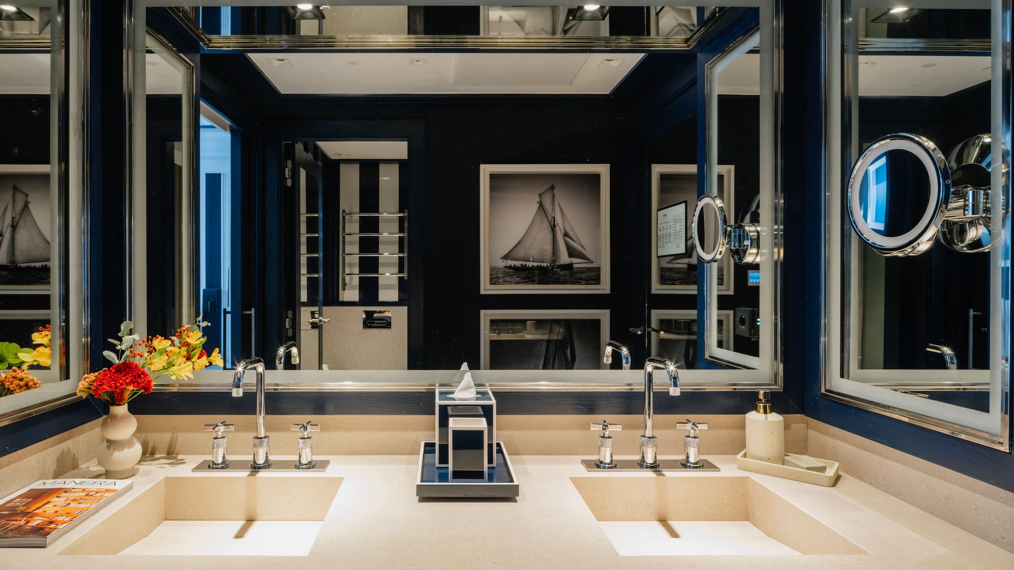 a bathroom with sinks and mirrors