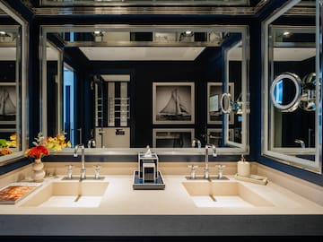 a bathroom with sinks and mirrors