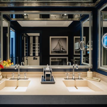 a bathroom with sinks and mirrors